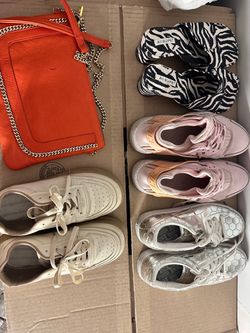 Different sizes shoes and one bag