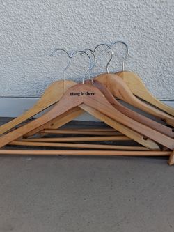 Wooden suit hangers plus pants