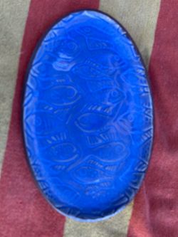 hand-carved ceramic stone with the phrase "LIVE WITH ALOHA" blue glass fish plate