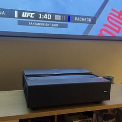 Benq 4K laser projector ultra short throw project with 120in anti glare screen.