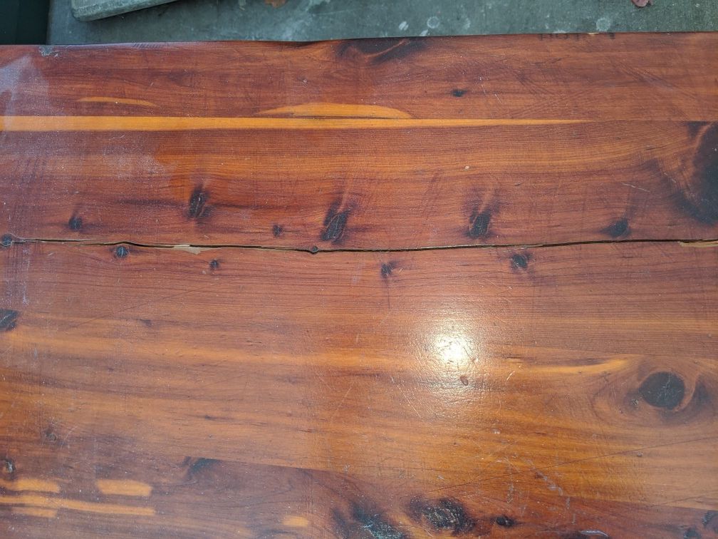 60+ yr old cedar chest. Beautiful wood..crack in top and needs new hinge...Would be a gorgeous redo, and needs a new home.