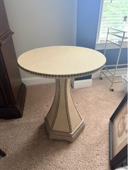 Beige Nail head round accent table