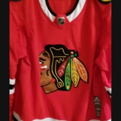 Adidas Chicago Blackhawks Jersey.  Size 56. New.  IF IT'S UP IT'S AVAILABLE.  THANKS 