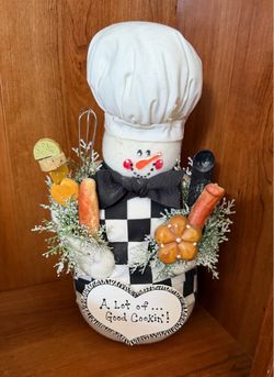 Adorable stuffed snowman cook display