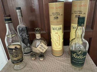 Empty Bourbon Bottles And Stoppers