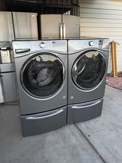Whirlpool Front Load Washer and Electric Dryer
