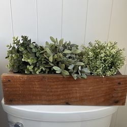 Planter with faux plants
