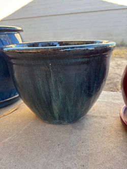 Multi colored glazed ceramic pot with drain hole