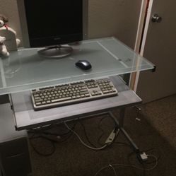 BEAUTIFUL GLASS COMPUTER DESK IN GOOD CONDITION WITH A SIDE TABLE 