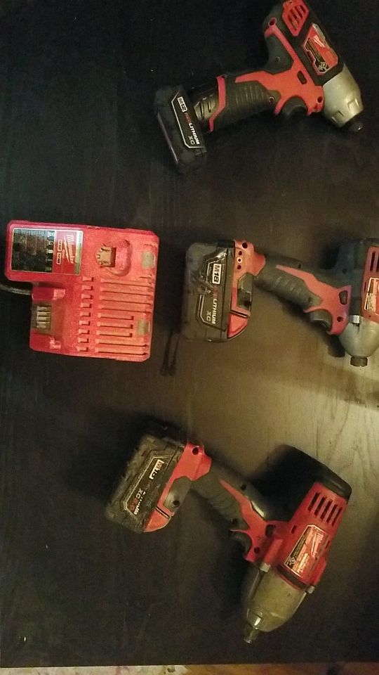 Milwaukee 2 impact driver and 1 1/2 impact wrench with charger