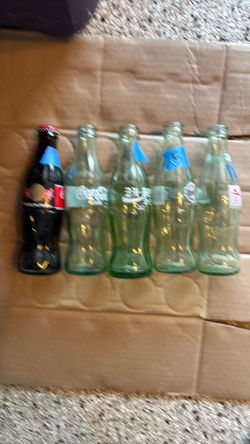 Coca Cola bottles (5) various.