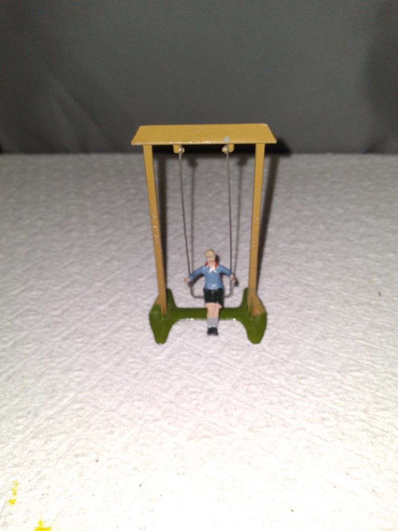 Antique Boy On A Swing