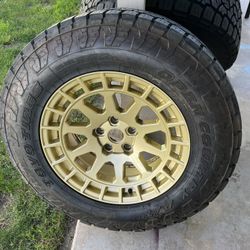 Slightly Used Toyo Open Country 275/65R18 - Gold black Rhino Rims