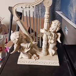 Cherubs Playing A Harp