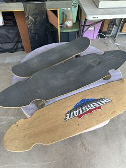 Longboards And A Skateboard