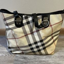 Preowned Burberry hand bag with restored leather handles.   Best offer negotiable 