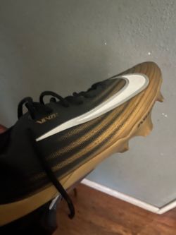 Nike black and gold swish