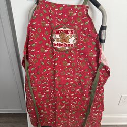 Vintage handmade holiday themed apron featuring a gingerbread “mom’s kitchen”