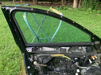 The driver-side (left) front door window for a 2018 Mazda 6 sedan