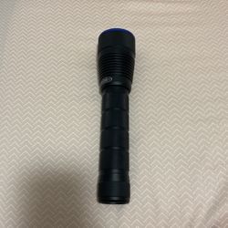 Police Flashlight Used For Light And Combat