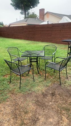 Black metal patio furniture and heater