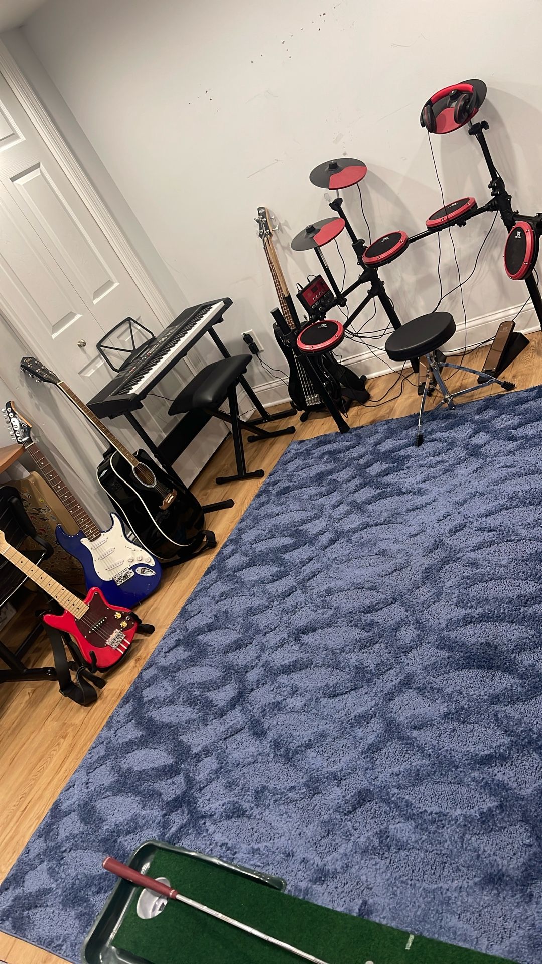 Children instruments, set of drums, electric keyboard, fender, guitar, electric guitar, electric bass FAO Schwartz, electric guitar