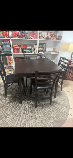 Wood folding card table and 4 chairs.