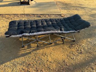 Folding camping cots with cushions