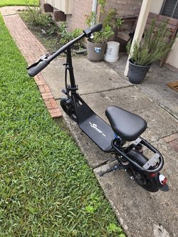 scooter Common with Charger. Good condition