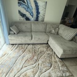Cream Sectional And Rug
