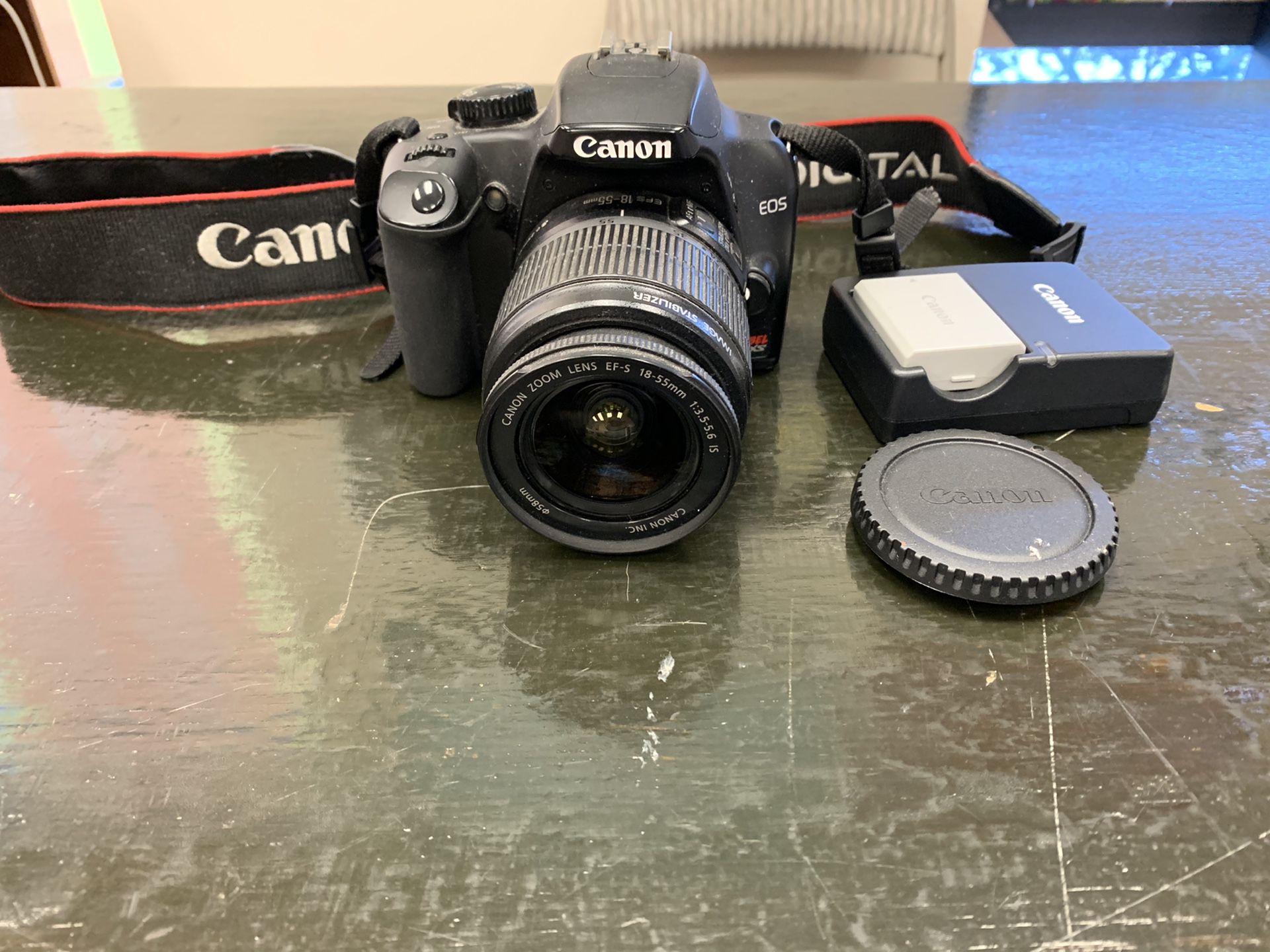 Professional Canon DSLR camera with lens and charger. Model rebel XS