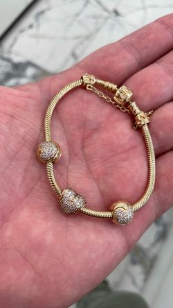 14k yellow gold Pandora bracelet w/ charms and locks
