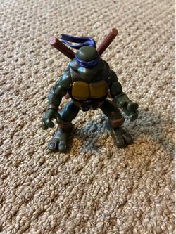 Ninja Action Donatello action figure released by Playmates Toys in 2004,