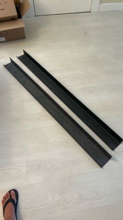 Black metal wall shelves.