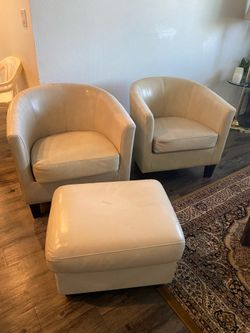 2 chairs with a small ottoman