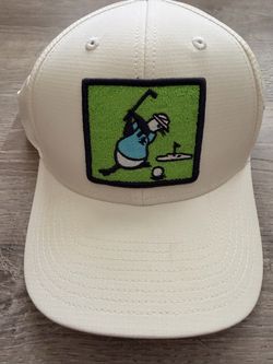 Penguin Golf Cap with embroidered golfer graphic on green background
