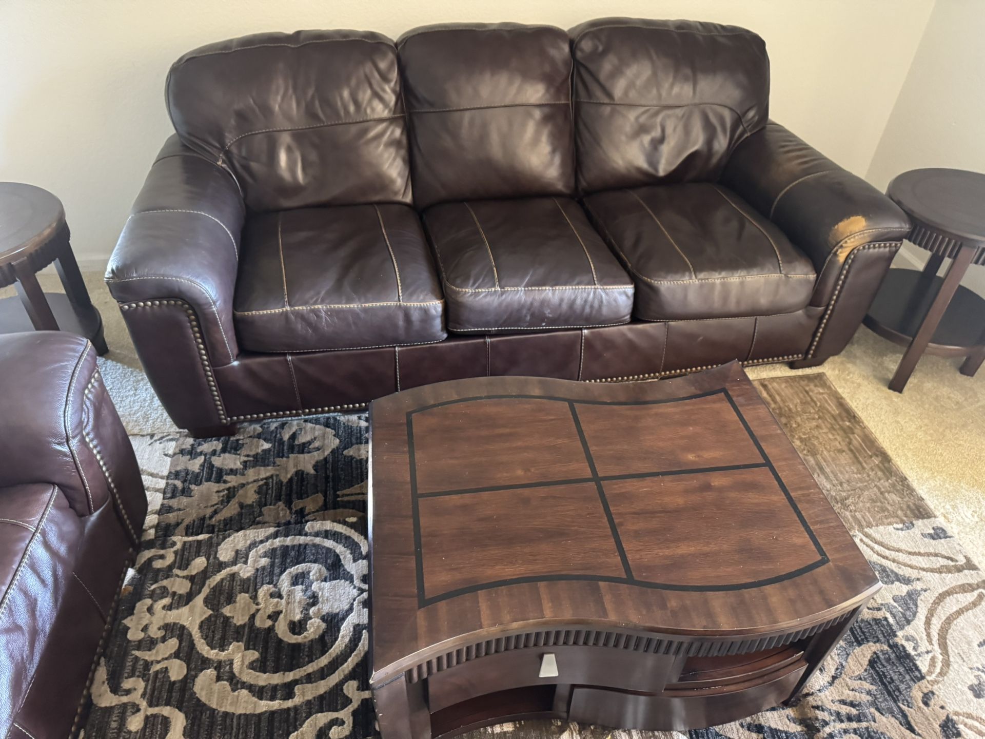 Leather couches $150 Large one One chair Only spot on the right by arm rest