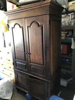 Dark wood armoire