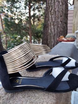 Adorable black with gold ankle ringlets flat sandals