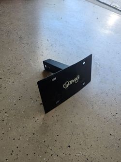 Hitch mounted license plate holder