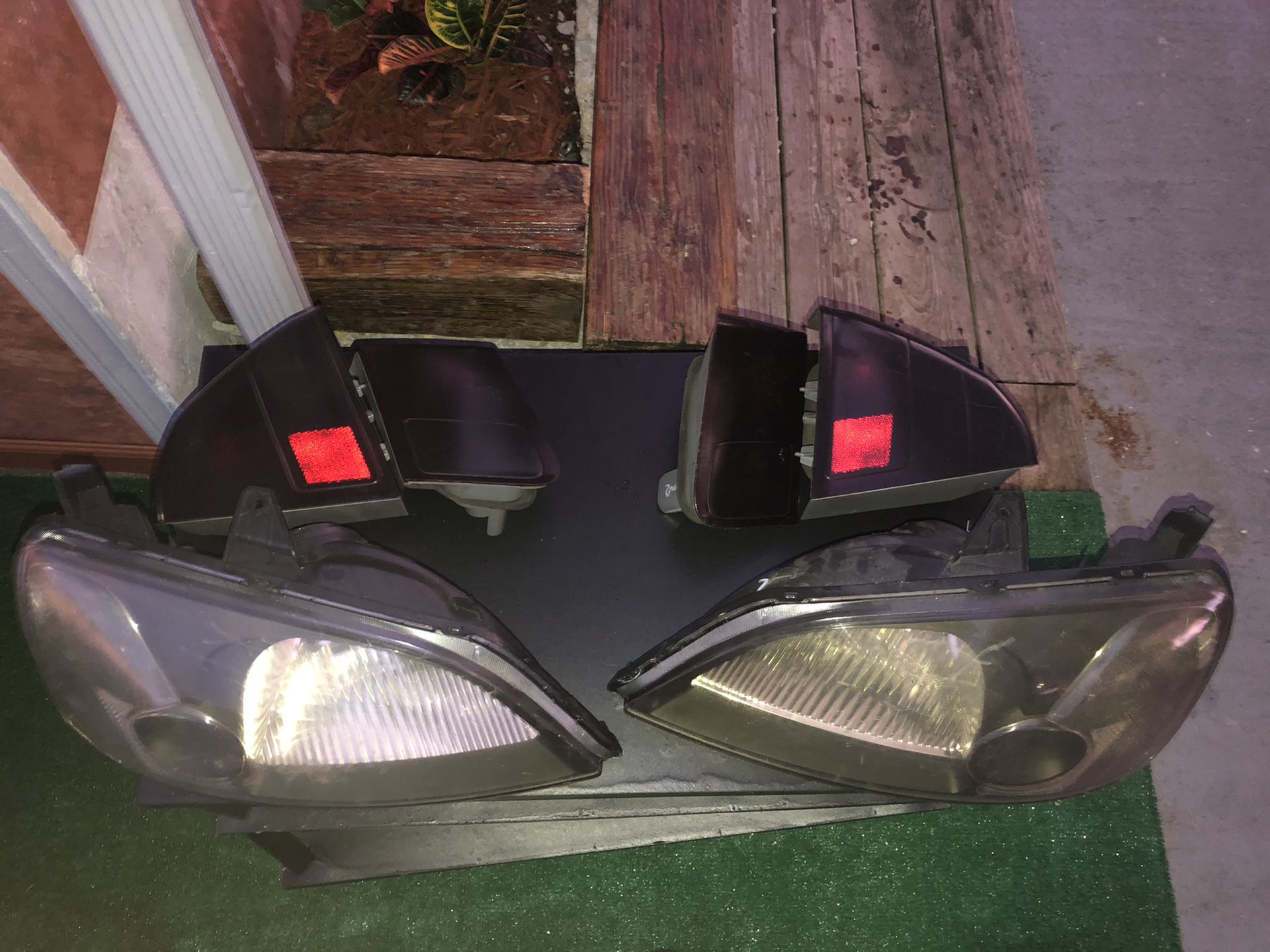OEM black headlights with tinted complete Brake lights For an 2001 to 2005 Honda Civic 4 door