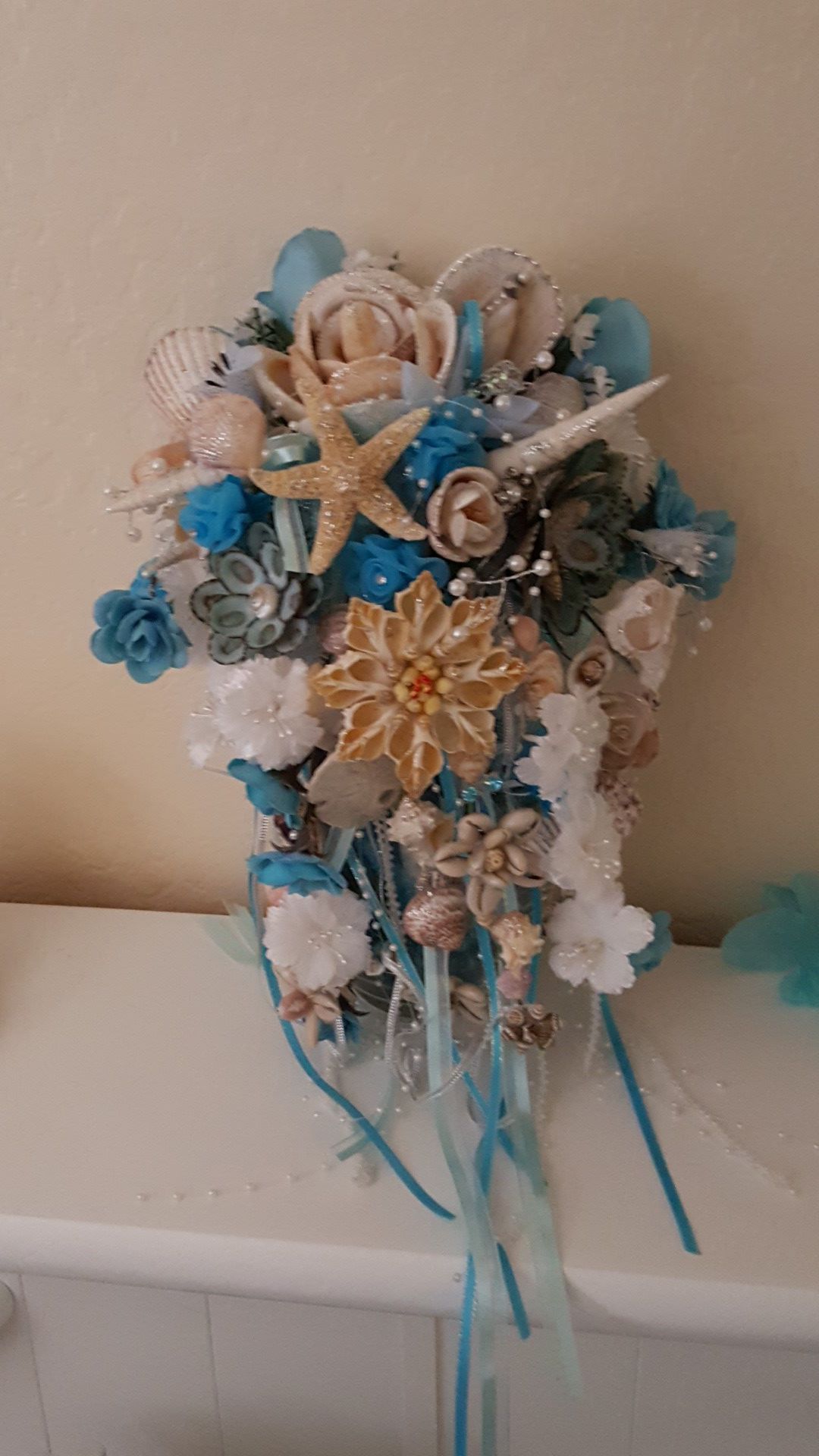 Custom-made seashell wedding bouquet centerpiece