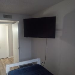 2 Twin Beds With A 55 Inch Smart Tv
