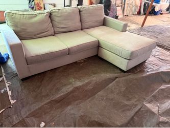 Gray couch with reversible chassis, great condition clean we sell all the time delivery $40 local