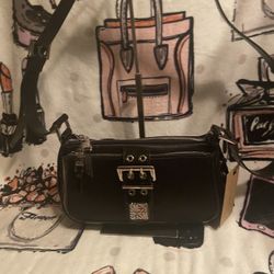 Authentic brand, new Steve Martin, black leather/canvas, Crossbody bag, black and color with silver hardware the scrap is not removable does not  come