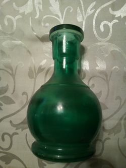 Vintage dark green glass vase/7.5 inches high/ bottom diameter 3.8 inches