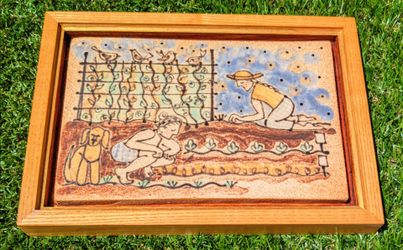 Framed Self-Portrait of Mary Deneen/Martha Winter "Gardening with Dog" on Ceramic Tile. 5.5" x 8". Pepin Farm Pottery, Maiden Rock, WI
