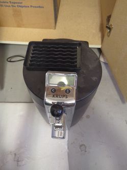 This is a Krups BeerTender home draught beer tap and cooling system