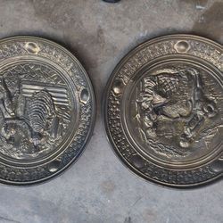 Two Bronze Looking Wall Plates 