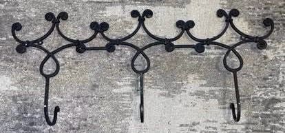 Black wrought iron wall hook rack very sturdy